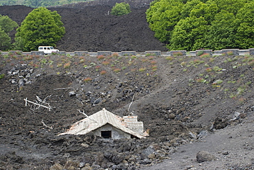 House covered in volcanic debris from Mt. Etna's last eruption, Sicily, Italy