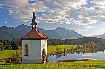 Chapel at a small lake in Autumn, Visitor at the Chapel, Buching, Allgau, East Allgau, Bavaria, Germany, BRD, Europe,