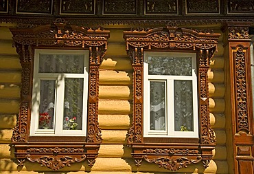 Decorated window frame of a timber building, Russia