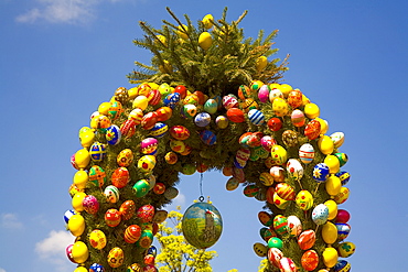 Easter fountain, top with coloured eggs, Waischenfeld, Franconian Switzerland, Bavaria, Germany, Europe