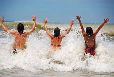 Young people having a bath at Pinamar beach, Buenos Aires province, Argentina