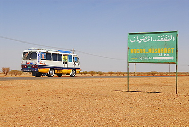 Bus on a country road near Naga, Sudan, Africa