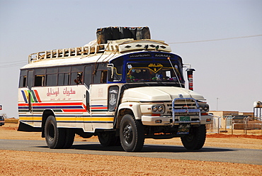 Bus on country road near Naga, Sudan, Africa