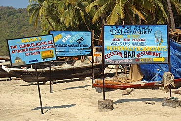 India, Goa, advertisment panels for bamboo huts on Palolem Beach