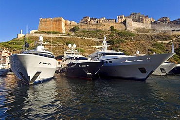 Megayachts anchoring below the old town of Bonifacio, Corsica, France