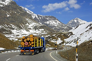 Truck transporting logs on the way up to the Julier Pass, Graubuenden, Grisons, Switzerland