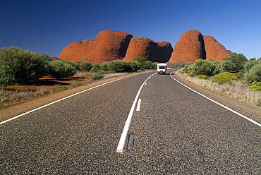 Car driving in front of the Kata Tjuta (Olgas), Uluru - Kata Tjuta national park, Australia