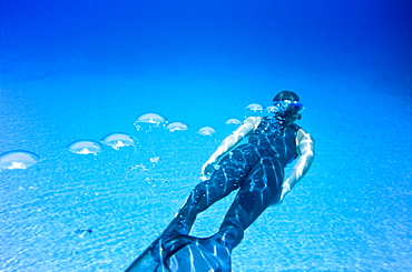 Woman snorkeling, Crete, Greece