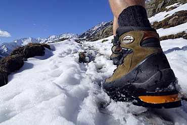 Feet and climbing boots of a hiker, Texelgruppe, South Tyrol, Italy