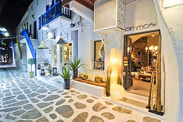 Illuminated alley with shops at night in Mykonos, Cyclades, Greece, Europe