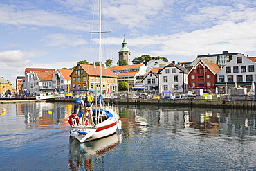 Sailboat in the harbour with Valbergtarnet, the former fire watch tower in the background, Stavanger (European Capital of Culture 2008), Norway, Europe