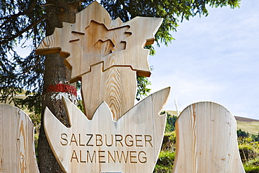 Wooden logo of the "Salzburger Almenwege, " Grossellmaualm, Grossarltal, Salzburg, Austria, Europe