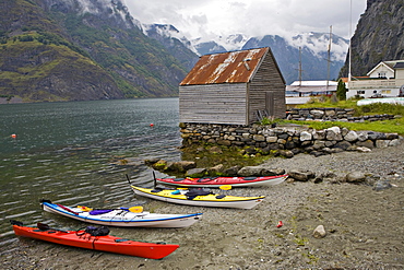 Kayaks on Undredal Beach along the Aurlandsfjord, Norway, Scandinavia, Europe