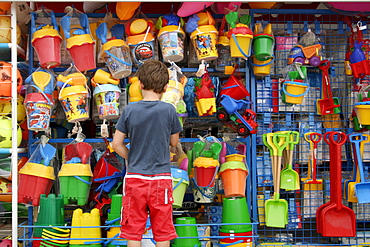 Child at a toy stand, Mallorca, Spain