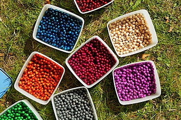 Containers filled with colourful beads for crafting