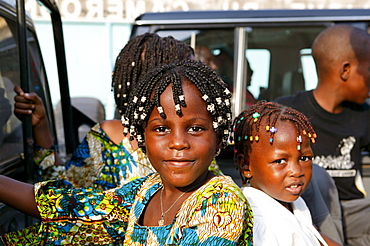 Two girls with elaborate braids in their hair, Cameroon, Africa