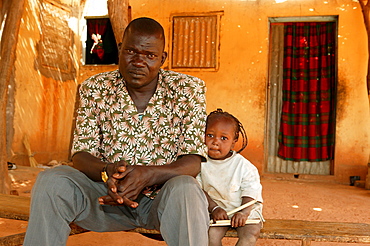 Father and half-orphaned child, HIV/AIDS infected, Cameroon, Africa