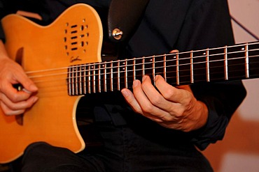 Man playing an electric guitar