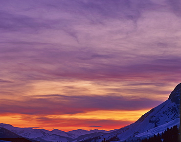 Mountain panorama set against a glowing night sky