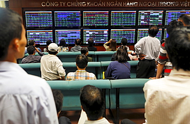 Stock trading at Vietcombank Securities, retail banking customers watch the stock prices on monitors, Hanoi, Vietnam, Asia