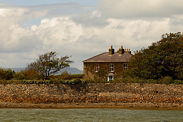 Solitary apartment house at a wall in Western Ireland, Ireland