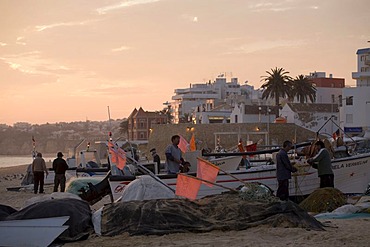 Fishermen and their boats on Praia do Armacao de Pera, Algarve, Portugal, Europe