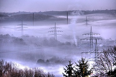 DEU Germany Bochum : High Voltage electrical power lines between Essen Bochum morning fog. |