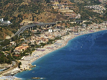 ITA, Italy, Sicily : The town of Taormina, in the northeast of the island. Motorway at the coast near Mazzeo. |