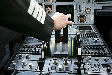 Pilot in cockpit of an Airbus A319, take off, engine power