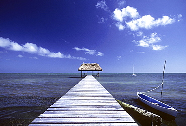 Boats beside a long dock, Caye Caulker Island, Belize, Central America