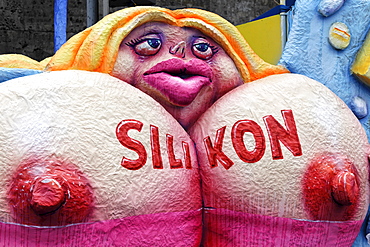 Paper-mache woman with large breast implants, Carnival (Mardi Gras) parade in Duesseldorf, North Rhine-Westphalia, Germany, Europe