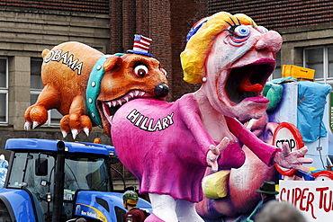 Political caricature, paper-mache Barack Obama biting Hillary Clinton in the ass, Carnival (Mardi Gras) parade in Duesseldorf, North Rhine-Westphalia, Germany, Europe