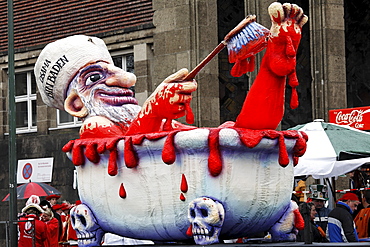 Political caricature, paper-mache Osama Bin Laden bathing in blood, Carnival (Mardi Gras) parade in Duesseldorf, North Rhine-Westphalia, Germany, Europe