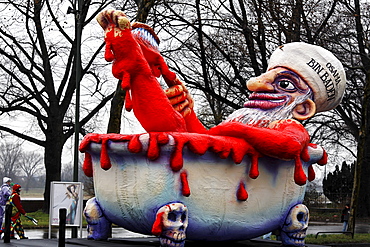 Political caricature, paper-mache Osama Bin Laden bathing in blood, Carnival (Mardi Gras) parade in Duesseldorf, North Rhine-Westphalia, Germany, Europe