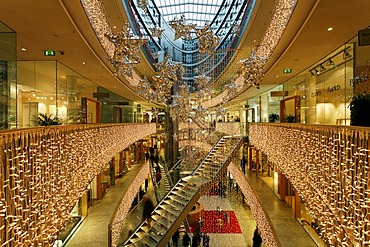 Hall of a multistoried modern department store decorated for christmas, stilwerk, duesseldorf, germany