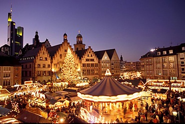 Frankfurt/M, Germany: Chistmas market on the Frankurt place "Roemerberg" with the town hall "Roemer" in the background, furtheron in the BG the tower of the "Paulskirche" and the building of the "Commerzbank"