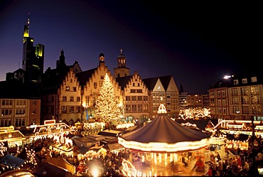 Frankfurt/M, Germany: Chistmas market on the Frankurt place "Roemerberg" with the town hall "Roemer" in the background, furtheron in the BG the tower of the "Paulskirche" and the building of the "Commerzbank"