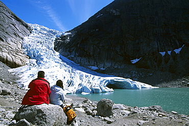 Tourists looking at the tongue of the Jostedalsbreen, Jostedal Glacier, Norway, Scandinavia, Europe