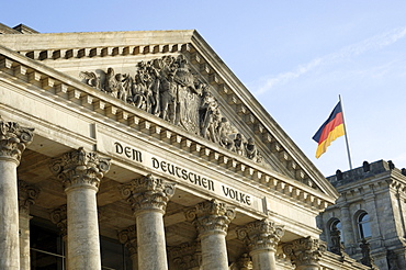 Reichstag (German parliament building) and German flag, Berlin, Germany