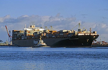 Huge container ship on river Elbe at Hamburg Germany