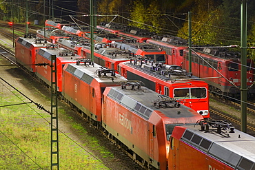 Parked electric locomotives at Maschen railroad shunting yard near Hamburg at night, Lower Saxony, Germany