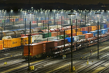 Parked freight trains at Maschen railroad shunting yard near Hamburg at night, Lower Saxony, Germany