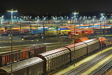 Parked freight trains at Maschen railroad shunting yard near Hamburg at night, Lower Saxony, Germany