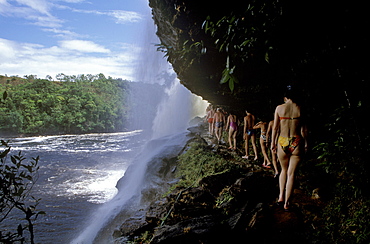 Tourists visiting Salto El Sapo Falls, Canaima, Gran Sabana, Venezuela, South America