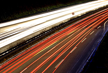 Blurred headlights during the vespertine rush hour traffic