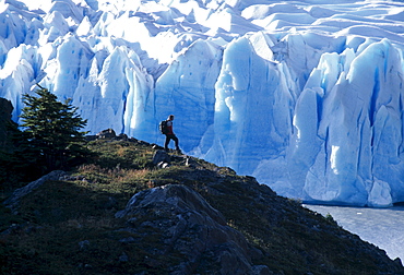 Hiker in front of the edge of Gray Glacier, Torres del Paine National Park, Patagonia, Chile, South America