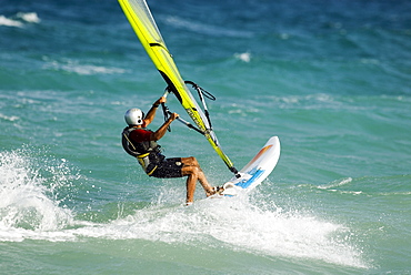 Windsurfer wearing helmet, Mediterranean coast, Spain