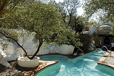 Phallus-shaped, phallic swimming pool in the garden at the former home of surrealist painter Salvador Dali and his wife Gala in Port Lligat, Province Girona, Spain