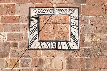 Sundial on the wall of Muenster Abbey, Villingen, Baden-Wuerttemberg, Germany, Europe