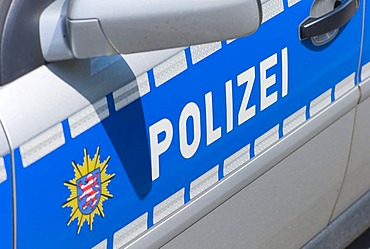 Police in lettering on a police car, Germany, Europe